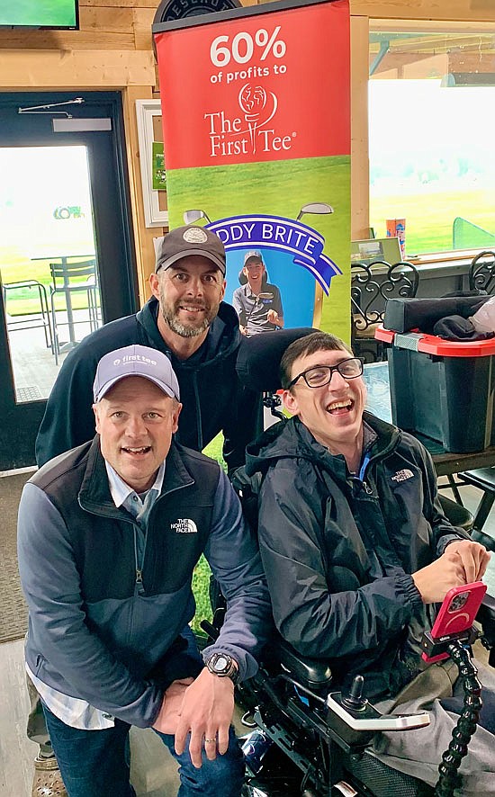 Mini-golf tournament organizer Cody Gemmer (at right) smiles for a group photo with Dan Wartelle, executive director of The First Tee of Greater Seattle, and Stubby Stocker of Snohomish Valley Golf Center.