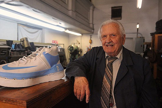 In 2018, Mihail Papadimitriou showed off a size 18 shoe from one of his many customers inside his shoe repair shop.