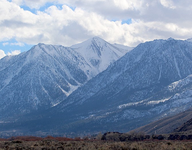 Clouds start to gather around Jobs Peak on Wednesday afternoon not long after a winter storm watch was upgraded to a warning starting Thursday night.