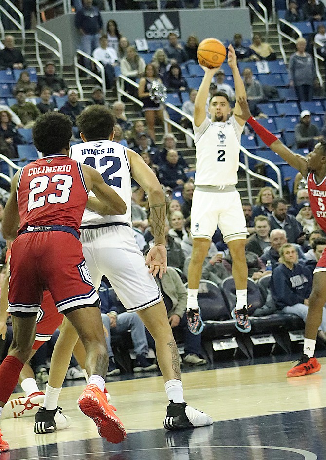 Nevada’s Jarod Lucas (2), who was recognized before Friday’s game for scoring more than 2,000 points in his Wolf Pack career, takes a long jump shot against Fresno State in the first half of their in Friday night’s game between Nevada and the Bulldogs.  Nevada won 74-66 at Lawlor Events Center.