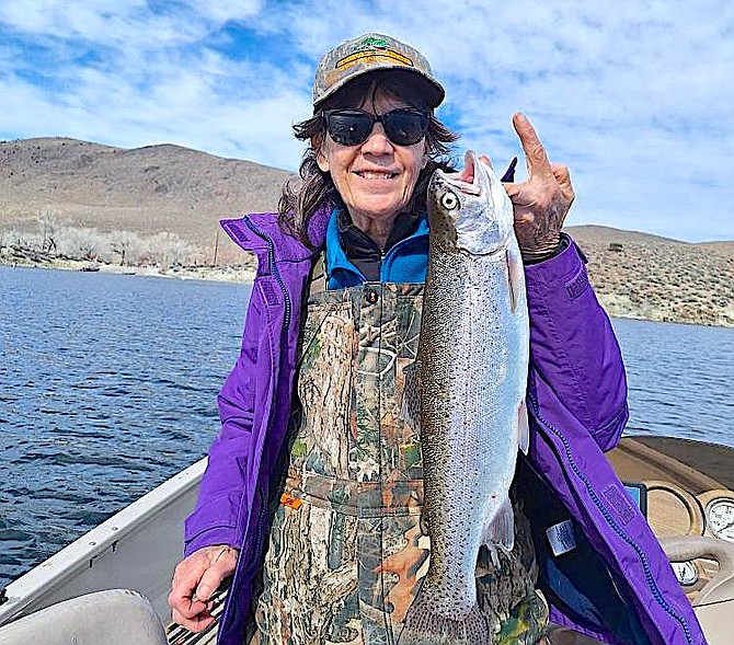 Renee Heinichen holds up a big fish she caught at Topaz Lake.
Photo by Doug Busey