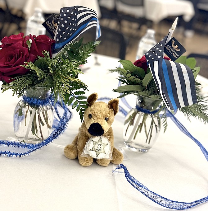 Flower pieces by A Wildflower decorated the table at the Douglas County Sheriff’s Office Advisory Council’s 20th anniversary Feb. 24.