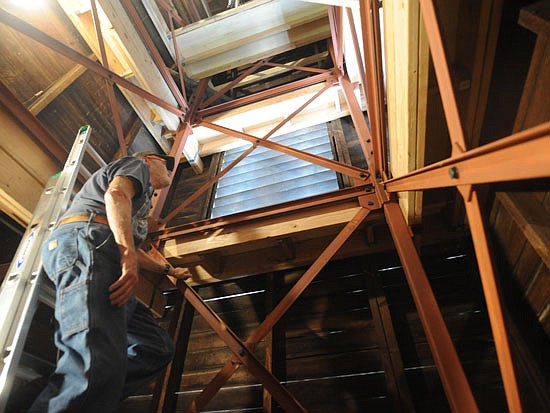 Earlier this year, Steve Kenagy climbed ladders to show a Tribune photographer the interior condition of the 128-year-old steeple at St. John's Episcopal Church in Snohomish, which underwent fixes this summer to correct its lean. The church plans to do more improvements in coming years.