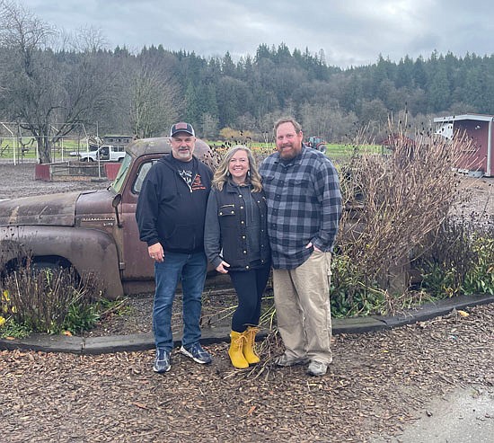 After decades growing the business, Mark Craven (on left) has been slowly handing off his family farm to new owners Kimi and Brian Chadwick.
