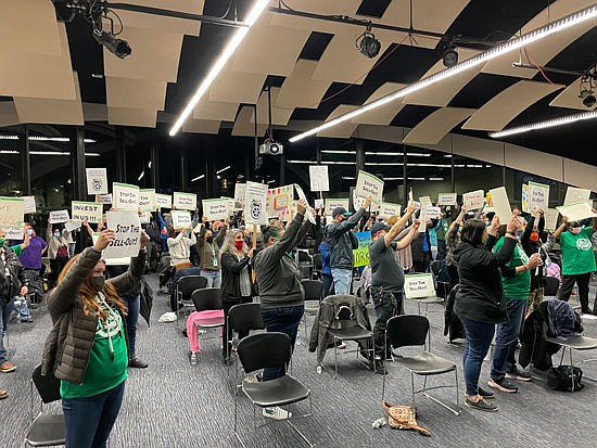Dozens of union members and supporters rallied Nov. 30 with protest signs and a small selection of speakers in the Jackson Conference Center on Everett Community College’s campus the night of the college’s board meeting.