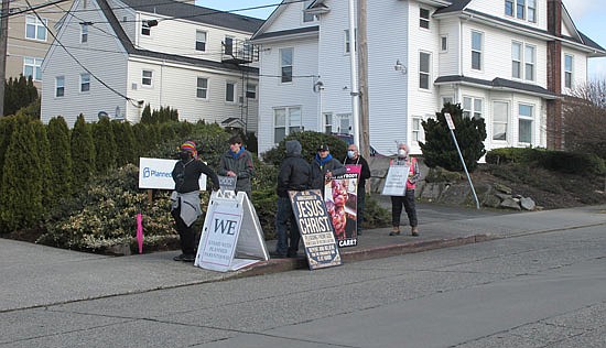 Every Wednesday, people both against and for Planned Parenthood on 32nd Street near Colby Avenue come out. This photo is from across the street at the tail end of activities Wednesday, Feb. 24 after many people had gone home.