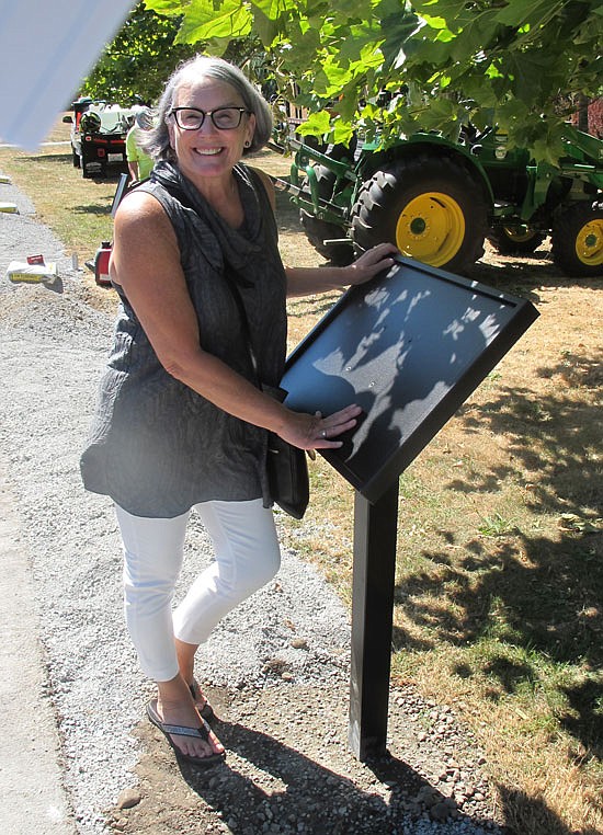 Terry Lippincott stands next to one of 22 new stations for the Snohomish Story Trail.