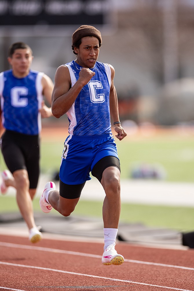 Carson High junior Kekoa Mitchell competes in the 100-meter dash at Douglas High School in the season-opening meet Thursday. Mitchell was third with a time of 11.62.