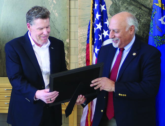 Nevada Lt. Gov. Stavros Anthony, right, congratulates Sean Laycox for being named Veteran of the Month for December.