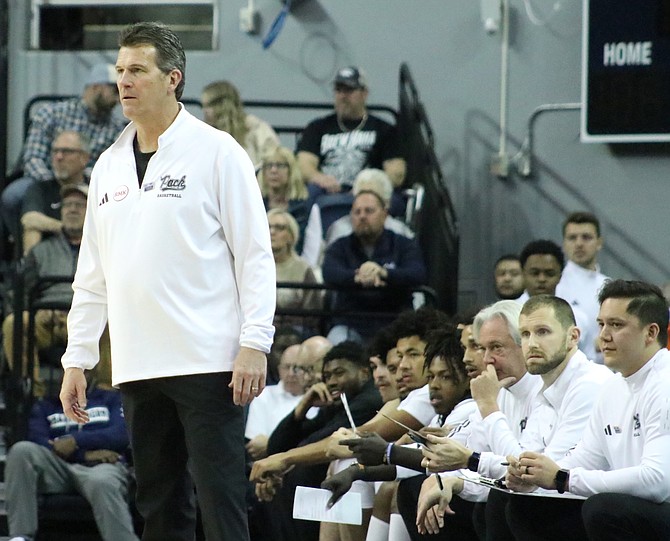 Nevada head coach Steve Alford (pictured earlier this season) and the Wolf Pack won at Boise State on Tuesday despite not grabbing a single offensive rebound.