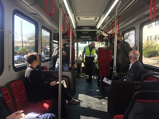 U.S. Rep. Rick Larsen (seated, right) went on a ridealong hosted by Everett Transit for the bus system to show off its new electric buses. The city is added nine more electric buses to its fleet by 2023. Others on the ride were Mayor Cassie Franklin (seated, left), Everett Transit director Tom Hingson (standing, right aisle), Deputy Mayor Nick Harper, and Transit Operations Manager Mike Schmieder (standing, center in green vest). Driver Vanessa Reyes drove the bus.