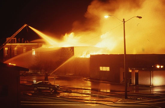 Five firefighters got trapped in the 1987 early-morning fire at the college's library. Detectives have finally solved who set it.