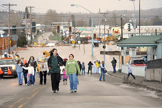 Floodwaters reached 33.49 feet in Snohomish on Jan. 8, 2009. Here, spectators criss-crossed the Avenue D bridge to go see the flooded-over intersection of Airport Way and Lowell-Snohomish River Road.