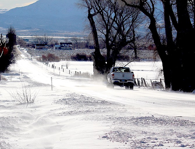 Snow blows across Genoa Lane on Monday morning modeling in Carson Valley what Washoe Valley was like that morning.