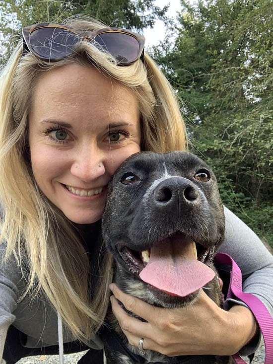 Lindsay Roe, who works as the development manager for the Everett Animal Shelter, hopes she can inspire the wider community. In the photo, she’s with Kenzy, one of her dogs.