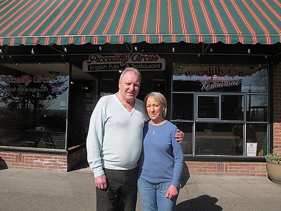 Geoff and Marion Wall opened shop in Snohomish some 30 years ago. Here, they stand for a photo outside Piccadilly Circus on First Street in late March.