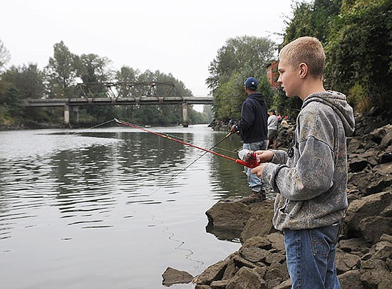 Erik Rodriguez, at the time 12, fishes on the Snohomish River in 2013.