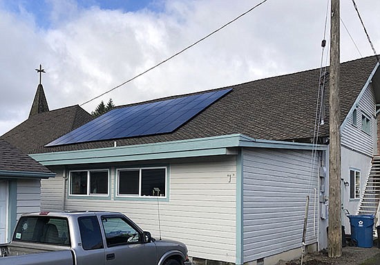 The Monroe Congregational Church added a solar panel system to its roof to help reduce its carbon emissions.