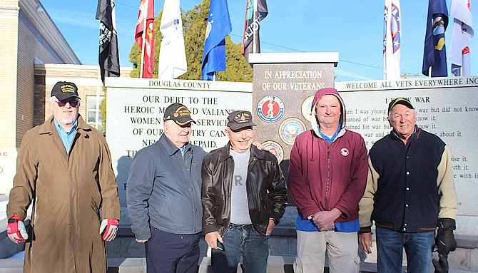 The board of Welcome All Veterans Everywhere on Nov. 11, 2022, including Darrol Brown, Carl Schnock, Barry Penzel, David Arroues and Tom Zagorski at the Veterans Memorial in front of the Douglas County Courthouse in Minden.