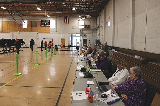 Poll workers sitting inside the Carson City Community Center on Feb. 6, 2024 election day for the Presidential Preference Primary.