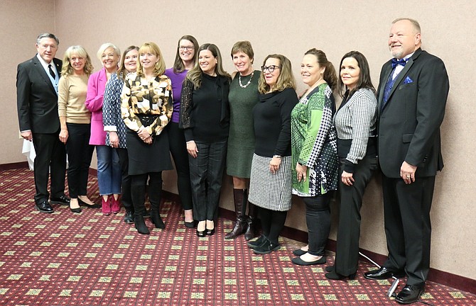 The Carson City Chamber of Commerce celebrated 10 local leaders Friday during its Women of Distinction event at the Gold Dust West Casino. Masters of ceremony Assembly PK O’Neill, far left, and Cliff Sorensen, far right, stand with honorees, from left, Lisa Schuette, Kitty McKay, Kelly Brandon, Niki Gladys, Sena Loyd, Marlene Maffei, Hope Sullivan, Jenny Lopicollo, Tasha Fuson and Elaine Barkdull Spencer.