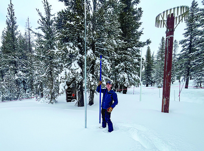 State hydrologist Jeff Anderson measures the snowpack at Mount Rose Summit on Feb. 8, 2024. (Amy Alonzo/The Nevada Independent)