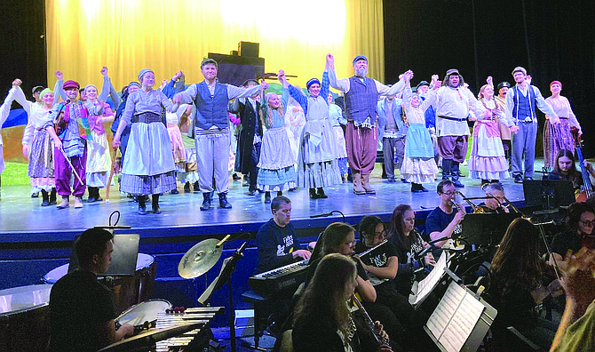 The cast and orchestra of “Fiddler on the Roof” presented by the Performing Arts of Churchill County take a curtain call after a sold-out show on March 8.