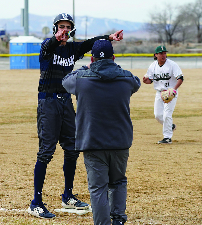 Oasis Academy’s Fenn Mackedon reacts after reaching third in Saturday’s win over Incline.