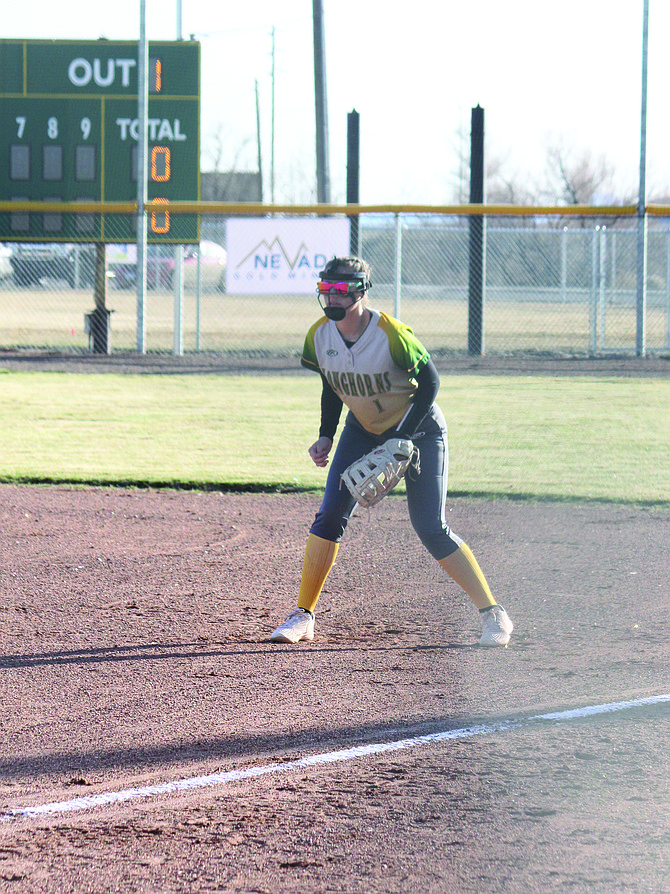 Battle Mountain's Addison Matheus sets herself at first base as she awaits the pitch.