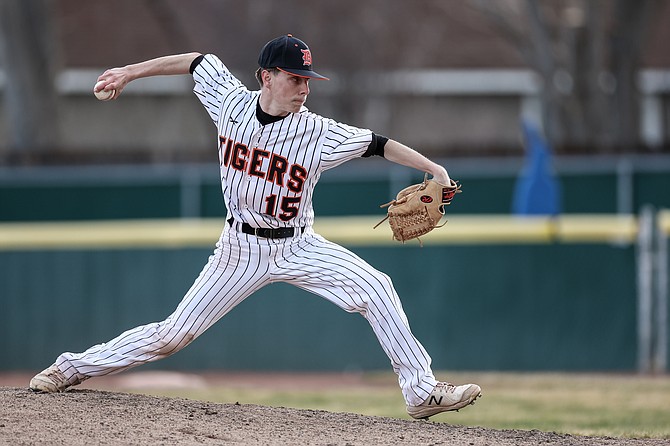 Douglas High junior Blake Faiss throws a pitch against Wooster Tuesday. Faiss recorded five outs, four of which were strikeouts in the Tiger win over the Colts.