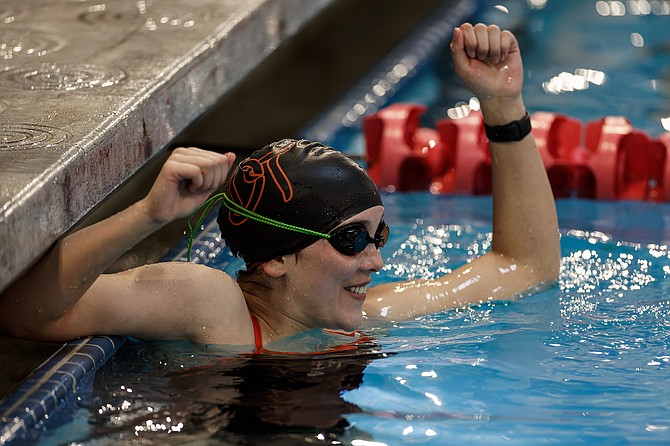 Douglas High senior Kiera Duffy celebrates after finishing a race, during the Tigers' swim and dive meet last weekend.