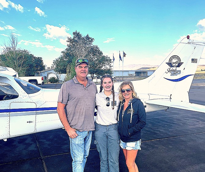 Jeff, Audrey and Heather Topp at the Silver Springs airport in September 2023 after Audrey had completed her first airplane solo flight.