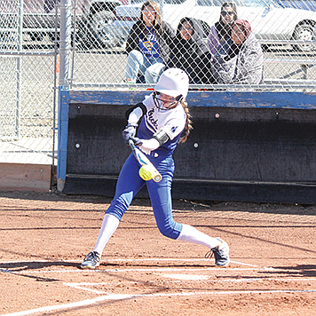 Lowry’s Adalyn Entwistle puts the ball in play against North Valleys on Friday in Winnemucca,