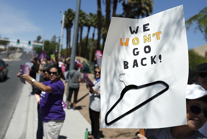 People rally in support of abortion rights, May 21, 2019, in Las Vegas.
