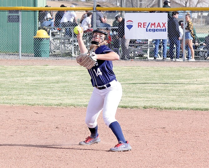 Oasis Academy’s Taylynn Maynez looks to throw out a Battle Mountain runner on Friday.