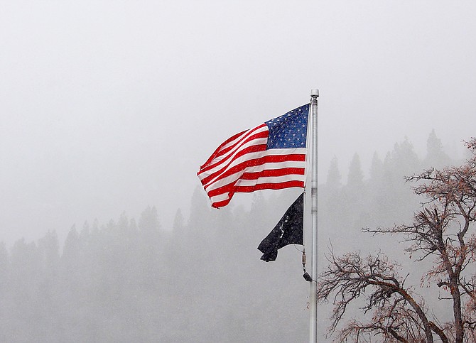 There was blowa and snowa in Genoa over the weekend with the flag at the post office snapping to attention on Saturday. More weather is in the forecast for Wednesday night.