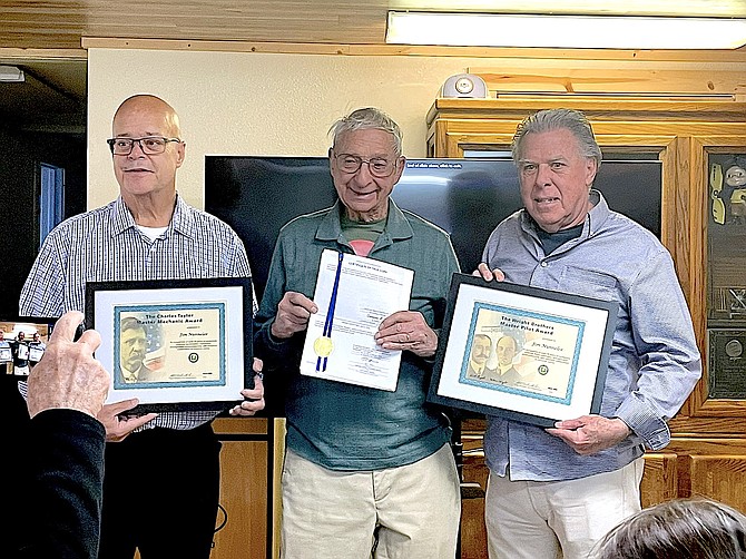 Federal Aviation Administration Safety Team program managers Russel Parker and Larry Cheek hold awards for Carson Valley aviator Jim Nunnelee, center, on March 20 in Carson City.
Special to The R-C