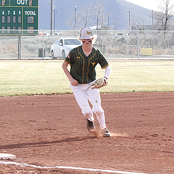 Battle Mountain’s Aiden Ruggles races to third base for a force out against Oasis Academy on Friday.