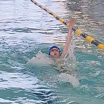 Barrett Buffington swims the backstroke in Elko.