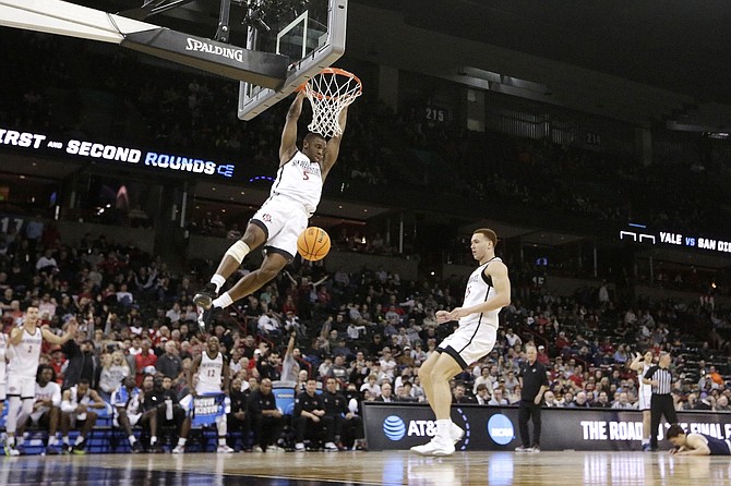 San Diego State guard Lamont Butler (5) dunks against Yale during the second round of the NCAA Tournament on March 24.