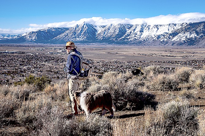 Retired East Fork Justice of the Peace Tom Perkins and his dog Maisy hiking above Jacks Valley. Photo special to The R-C by Jay Aldrich.