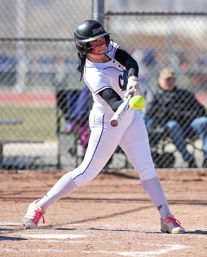 Carson High’s Kiele Franco gets a hold of a base hit, during a softball game against Franklin early this spring. Franco had four hits in a doubleheader against Galena Saturday.