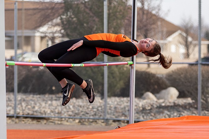 Douglas High senior Logan Karwoski clears the bar, during the high jump at Douglas High School earlier this season. Karwoski took second in the high jump event at Reed this past weekend with a clearance of four feet, 10 inches.