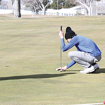 Lowry’s Landon Esquivel lines up a putt during an icebreaker tournament in Winnemucca in March.