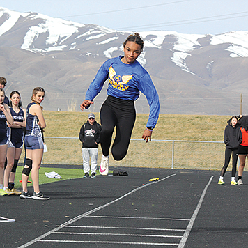 Lowry’s Kiana Head gets airborne in the triple jump at the Battle Mountain Invitational.
