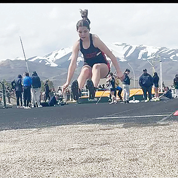 CHELSEA MONTES • Provided to Great Basin Sun
Emma Blondheim competes in the long jump at the Battle Mountain Invitational last Friday.