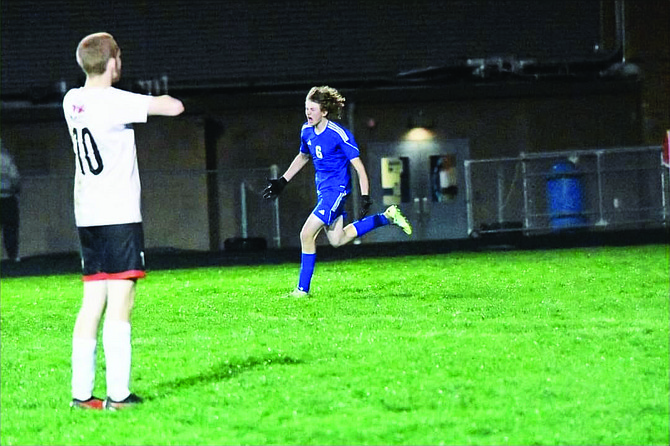 Eatonville's Austen Quirie unleashes a roar of excitement after scoring the game-winning goal against Tenino.