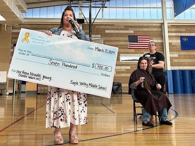 Eagle Valley Middle School teacher Michaela Filocamo, sitting, donated her hair at an event March 21 in her school gym and raised more than $1,500 through students, families and colleagues that she provided to the Northern Nevada Children’s Cancer Foundation. The NNCCF supports local children and their families battling pediatric cancer.