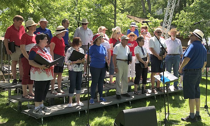 Director Gary Schwartz with Carson Chamber Singers at a July 4 concert in Genoa.