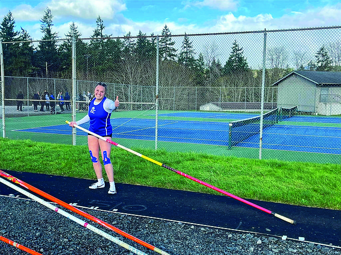 Eatonville senior Ryan Stammen gives a thumbs up in approval of her personal best vault that earned her a first-place finish.